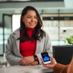 Patient and healthcare receptionist using Pocketalk to communicate