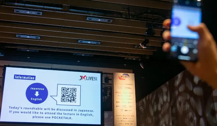 User scanning a participant QR code for live translations